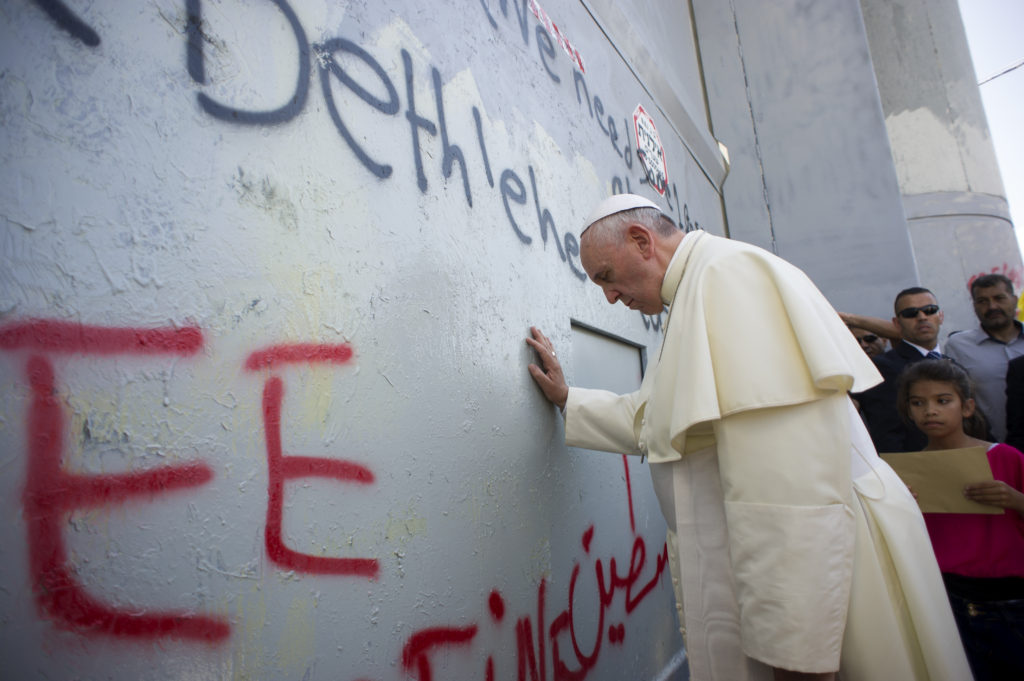 Pope Francis stops in front of the Israeli security wall in Bethlehem, West Bank, May 25. (CNS photo/L'Osservatore Romano, pool)