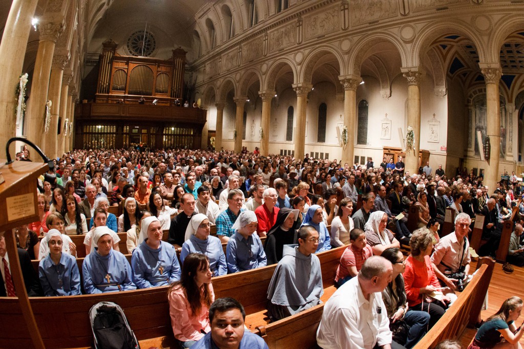 An estimated 2,000 people attend holy hour May 12 at St. Paul Church in Cambridge, Mass., in reaction to plans for a satanic ritual "black mass" to be held in a pub on the Harvard University campus. The student group organizing the "black mass" ultimately cancelled the event. (CNS photo/Gregory L. Tracy, Pilot) 