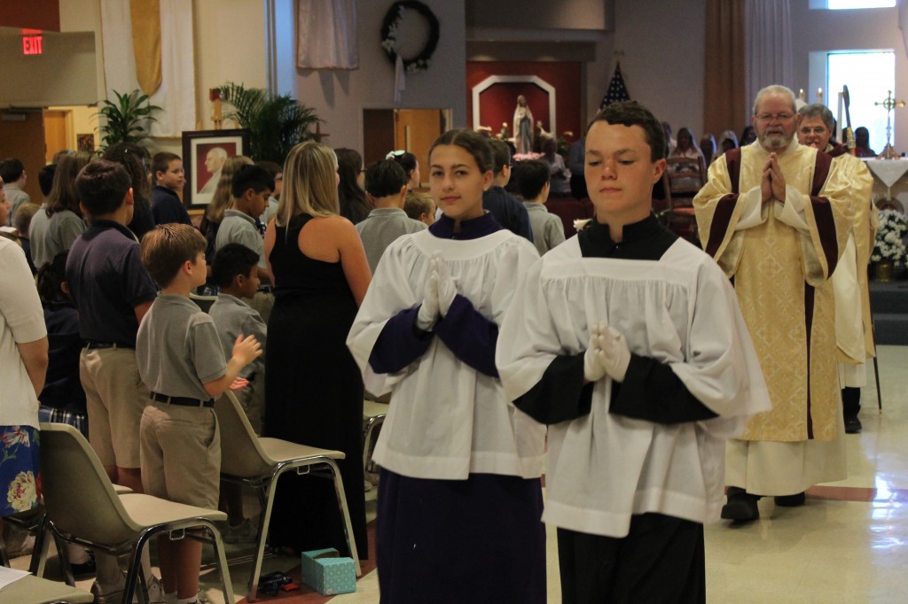 Altar servers lead the closing procession of a Mass celebrating the canonization of the school's namesake at Bl. Pope John XXIII School in Scottsdale. The school will officially change names for the 2014-15 academic year. (Ambria Hammel/CATHOLIC SUN)