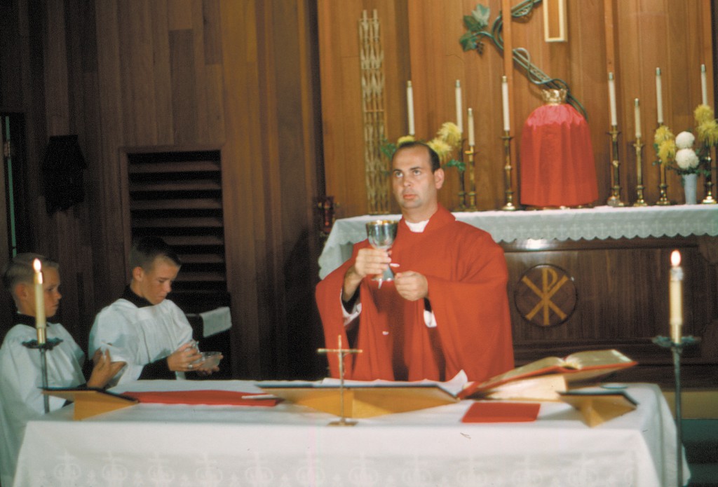 Msgr. Richard Moyer, 1966, celebrating Mass at St. Francis Church in Yuma. He was ordained May 3, 1964. Msgr. Moyer has had many roles in the Phoenix Diocese, including vicar general and rector of Ss. Simon and Jude Cathedral. (Courtesy photo)