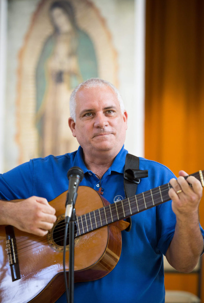 Deacon Juan Carlos Pagan, a program coordinator in Hispanic ministry for the Diocese of Lafayette, La., leads the music at a 2013 encuentro in St. Augustine, Fla. (CNS photo/Tom Tracy)