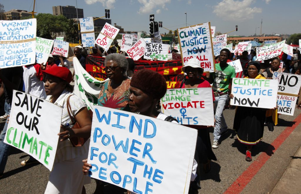 Local residents march in Durban, South Africa, ahead of the international climate talks in this 2011 file photo. Pope Benedict XVI urged leaders to reach a credible agreement on climate change, keeping in mind the needs of the poor and of future generations. (CNS photo/ Siphiwe Sibeko, Reuters) 