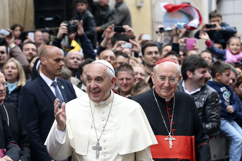 Pope Francis waves as he leaves at the end of a Mass for the Polish community at Stanislaus Parish in Rome May 4. At right is Cardinal Agostino Vallini, papal vicar for Rome. (CNS photo/Alessandro Bianchi, Reuters)