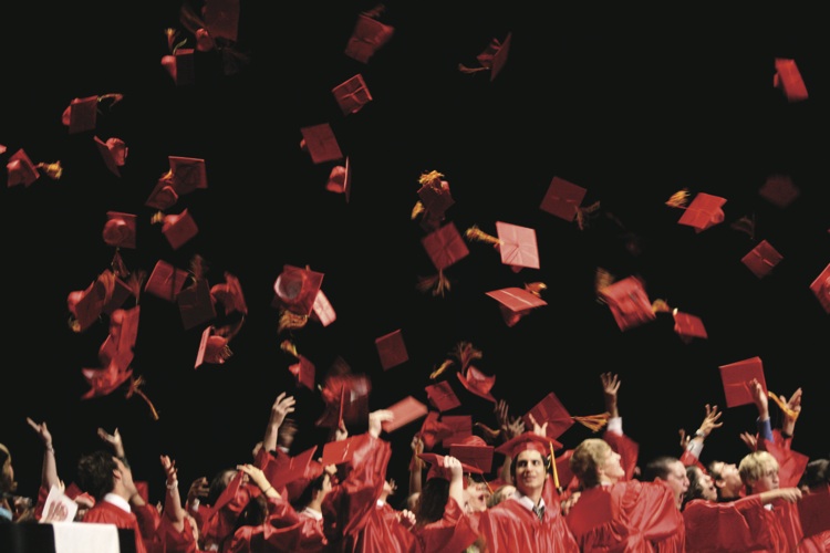 Seton graduates toss their mortarboards at the end of the 2010 commencement ceremony. (Catholic Sun file photo).