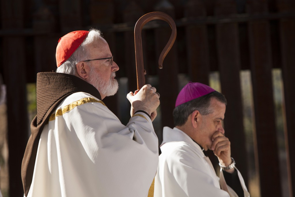Cardinal Sean P. O’Malley of Boston and Auxiliary Bishop Eusebio Elizondo of Seattle are seen during Mass at the border fence in Nogales, Ariz., April 1. About a dozen U.S. bishops took part in a two-day visit to the U.S. border with Mexico calling attention to the plight of migrants and appealing for changes in U.S. immigration policy. (CNS photo/Nancy Wiechec)