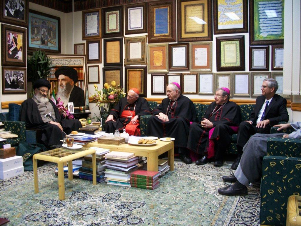 U.S. Cardinal Theodore E. McCarrick, retired archbishop of Washington, Bishop Richard E. Pates of Des Moines, Iowa, and Baltimore Auxiliary Bishop Denis. J. Madden meet with Seyyed Mahmoud, left, at the Ayatollah Marashi Najafi Library in Qom, Iran, in March. At right is Stephen Colecchi, director of the U.S. bishops ' office of International Justice and Peace. The meeting was part of a dialogue between the bishops and Iranian Muslim leaders on nuclear weapons. (CNS photo/courtesy Stephen M. Colecchi)