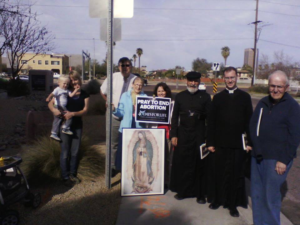 Fr. Joseph Terra, F.S.S.P. and Fr. Kenneth Walker, F.S.S.P. pray outside an abortion clinic March 6. Local pro-life activists will hold a prayer vigil June 21 in honor of Fr. Walker who was killed June 11. (Courtesy photo, 40 Days for Life)
