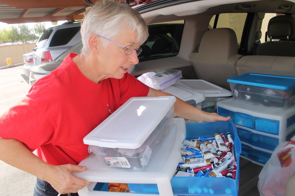 Judi Messer’s red Jeep houses a storehouse of necessities she hands out to the needy in the care packages she designs as part of the Hands of Hope project. (Joyce Coronel/CATHOLIC SUN)