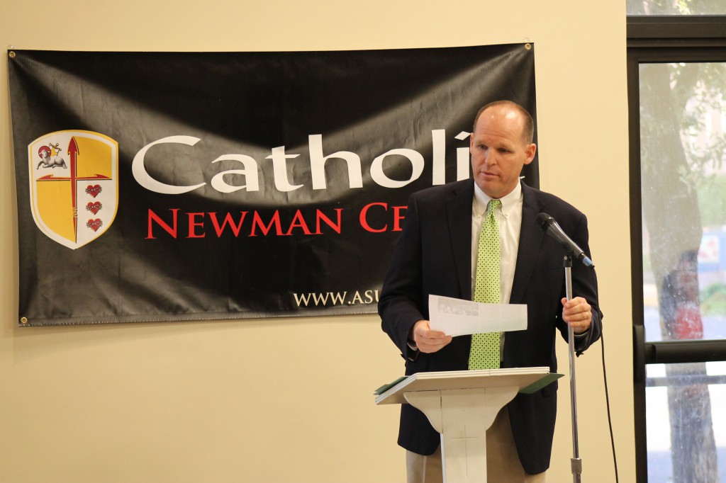 Wayne Rich, chairman of the Newman Center's advisory council, addressed the crowd at the  "Come and See" event. 