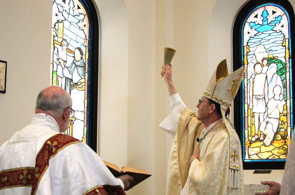 Bishop Thomas J. Olmsted blesses the Fra Angelico window in the Diocesan Pastoral Center's chapel June 26. 