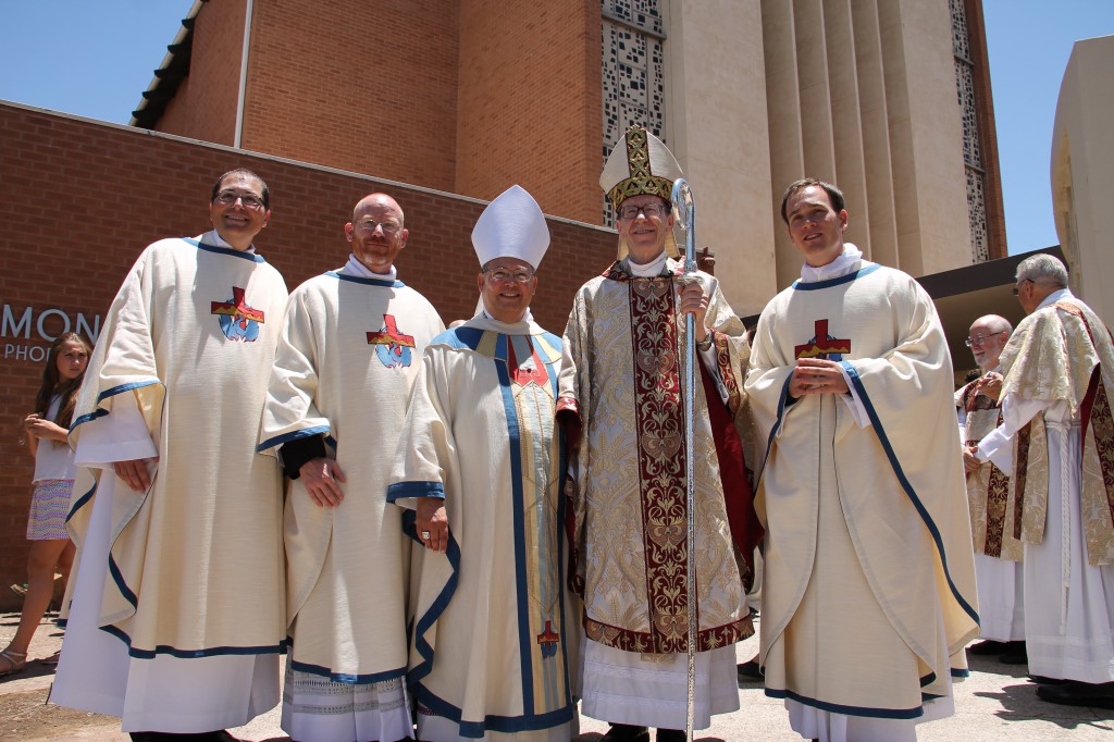 Fr. Scott Sperry, Fr. Keith Kenney and Fr. Kevin Grimditch stood outside the cathedral with Bishop Olmsted and Auxiliary Bishop Nevares moments after the Mass of ordination. 