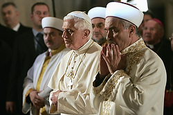 Pope Benedict XVI and Mustafa Cagrici, the grand mufti of Istanbul, pray in the Blue Mosque in Istanbul in this 2006 file photo.(CNS photo/Patrick Hertzog, Pool via Reuters)