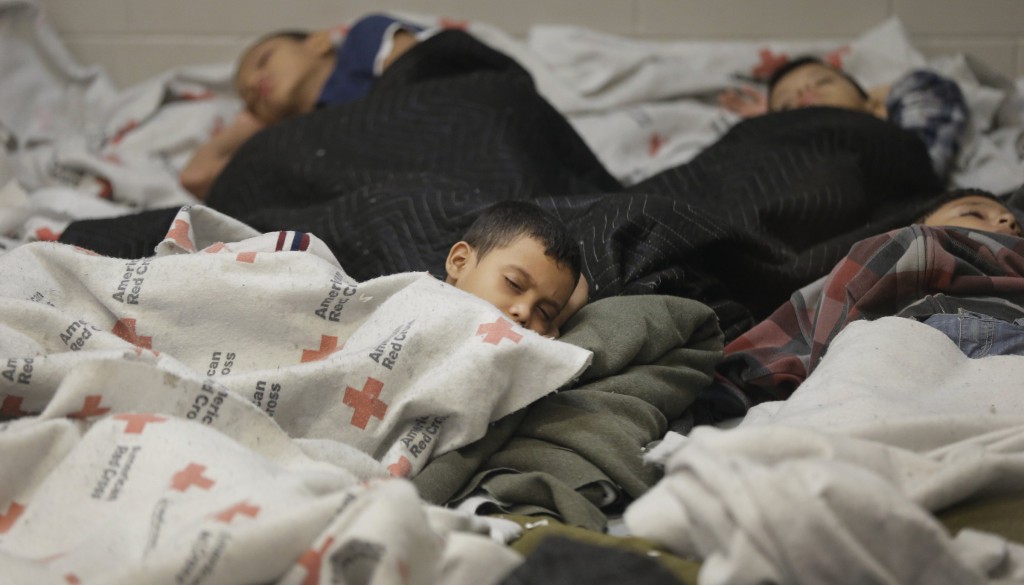 Detainees sleep in a holding cell at a U.S. Customs and Border Protection processing facility in Brownsville, Texas, June 18. The federal agency provided media tours June 18 of two locations in Brownsville and Nogales, Ariz., that have been central to processing at least 52,000 unaccompanied minors who have been detained in the U.S. this fiscal year. (CNS photo/Eric Gay, pool via Reuters) 