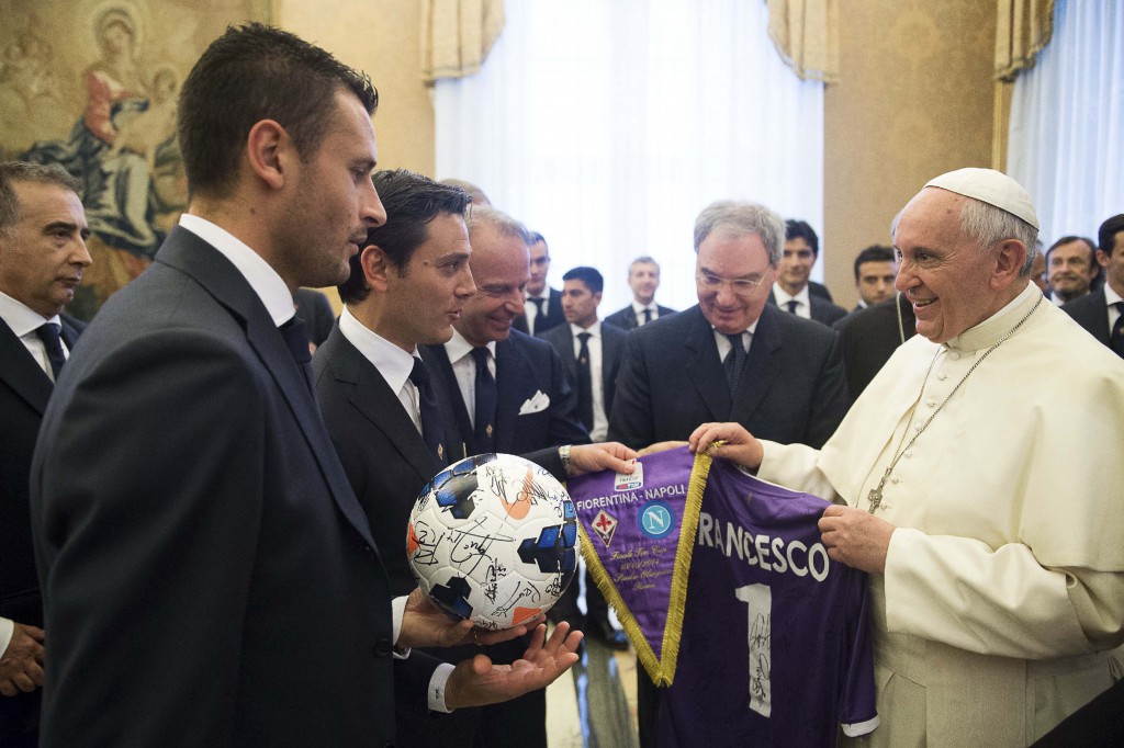 Fiorentina's coach Vincenzo Montella, third from left, presents a gift to Pope Francis during a special audience with soccer teams Fiorentina and Napoli at the Vatican May 2. (CNS photo/L'Osservatore Romano via Reuters)