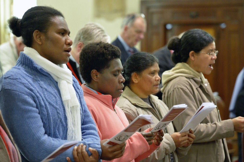 Participants in a memorial Mass at St. John the Evangelist Church in Melbourne, Australia, July 20 remembered the AIDS scientists and others who lost their lives in the crash of the Malaysia Airlines Flight MH17 shot down over Ukraine. The AIDS workers were on their way to Australia for the 20th International AIDS Conference. (CNS photo/Paul Jeffrey)