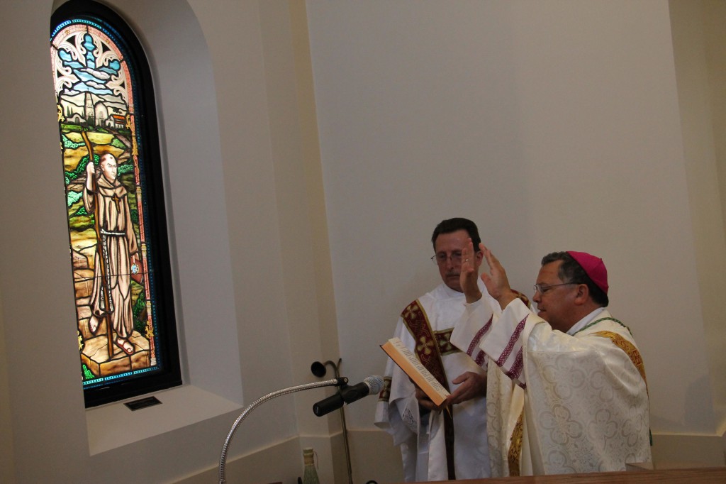 Bishop Eduardo A. Nevares reads a prayer during the blessing of the new stained glass window of Blessed Junipero Serra July 1 which several members of the diocese's Serra Clubs sponsored. (Ambria Hammel/CATHOLIC SUN)