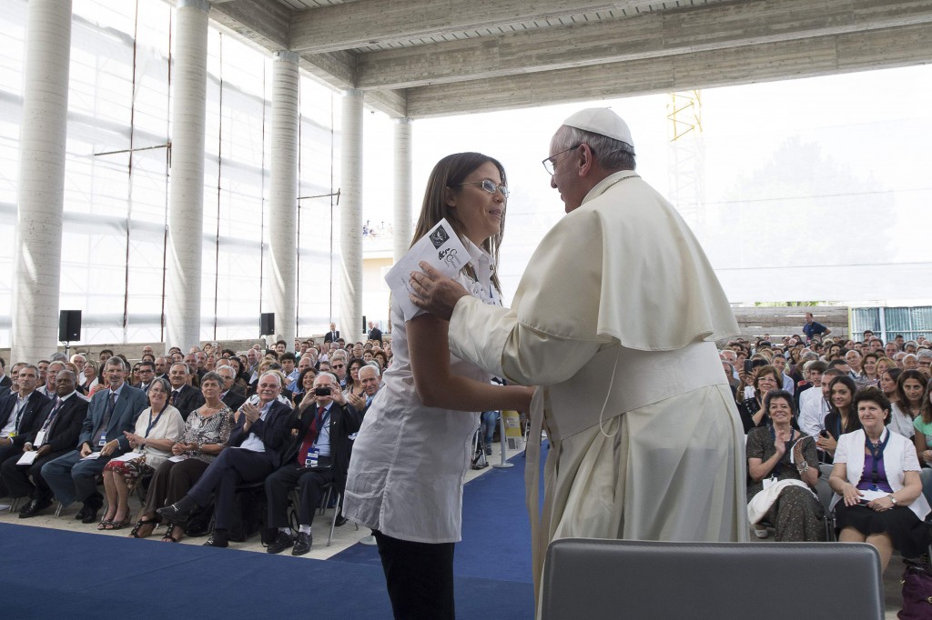 Pope Francis greets a woman during his visit with Giovanni Traettino, a Protestant pastor and his friend, in Caserta, Italy, July 28. Pope Francis said he knew people would be shocked that he would make such a trip outside of Rome to visit a group of Pentecostals, but "I went to visit my friends." (CNS photo/ L'Osservatore Romano via Reuters) 