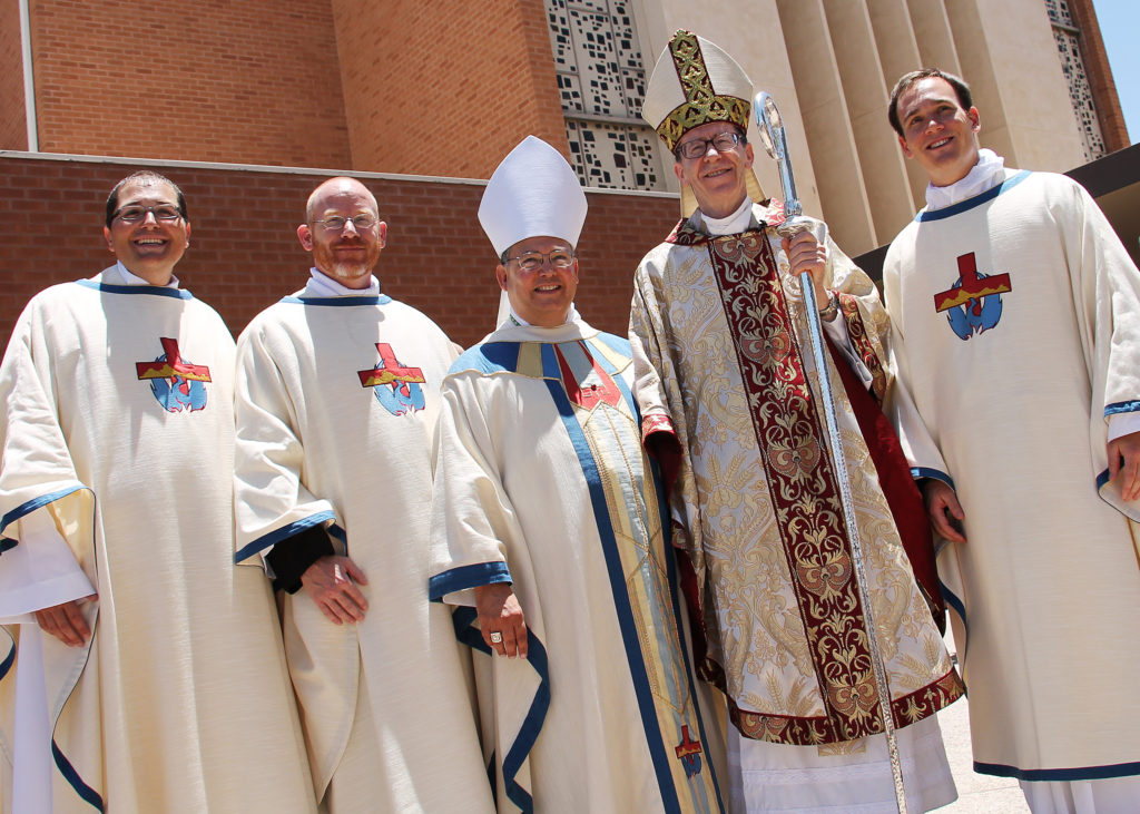 Newly ordained priests Fr. Scott Sperry, Fr. Keith Kenney and Fr. Kevin Grimditch are seen here with Auxiliary Bishop Eduardo A. Nevares and Bishop Thomas J. Olmsted following the June 28 ordination Mass at Ss. Simon and Jude Cathedral. (Ambria Hammel/CATHOLIC SUN)