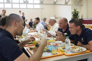Pope Francis eats with Vatican workers during a surprise visit to the Vatican cafeteria July 25. (CNS photo/L'Osservatore Romano via Reuters)