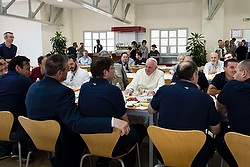 Pope Francis talks with Vatican workers during a surprise visit to the Vatican cafeteria July 25. (CNS photo/L'Osservatore Romano via Reuters)