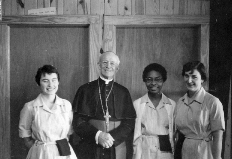 Mississippi Bishop Oliver Gerow is pictured in this 1960 photo with members of Pax Christi in Greenwood, Miss. Bishop Gerow, head of the Diocese of Jackson, Miss., from 1924 to 1967, steered Catholics in the state through some of the darkest days of the civil rights movement. He released a statement urging lawmakers to support the Civil Rights Act of 1964, signed into law by President Lyndon B. Johnson July 2 of that year. (CNS photo/courtesy Diocese of Jackson Archives)