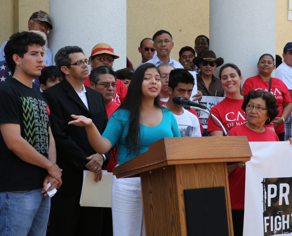 Cindy Monge, a 19-year-old Silver Spring, Md., resident and immigrant from Guatemala, speaks during a July 7 news conference in Washington near the White House organized by Casa de Maryland and other pro-immigration reform groups. Several speakers at the event urged the Obama administration to provide relief for all children and their families who have crossed the U.S. border illegally to flee violence in Central America. (CNS photo/Chaz Muth)