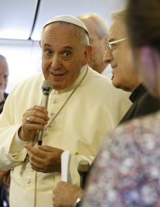 Pope Francis responds to a journalist's question aboard the papal flight from Seoul, South Korea, to Rome Aug. 18. (CNS photo/Paul Haring)