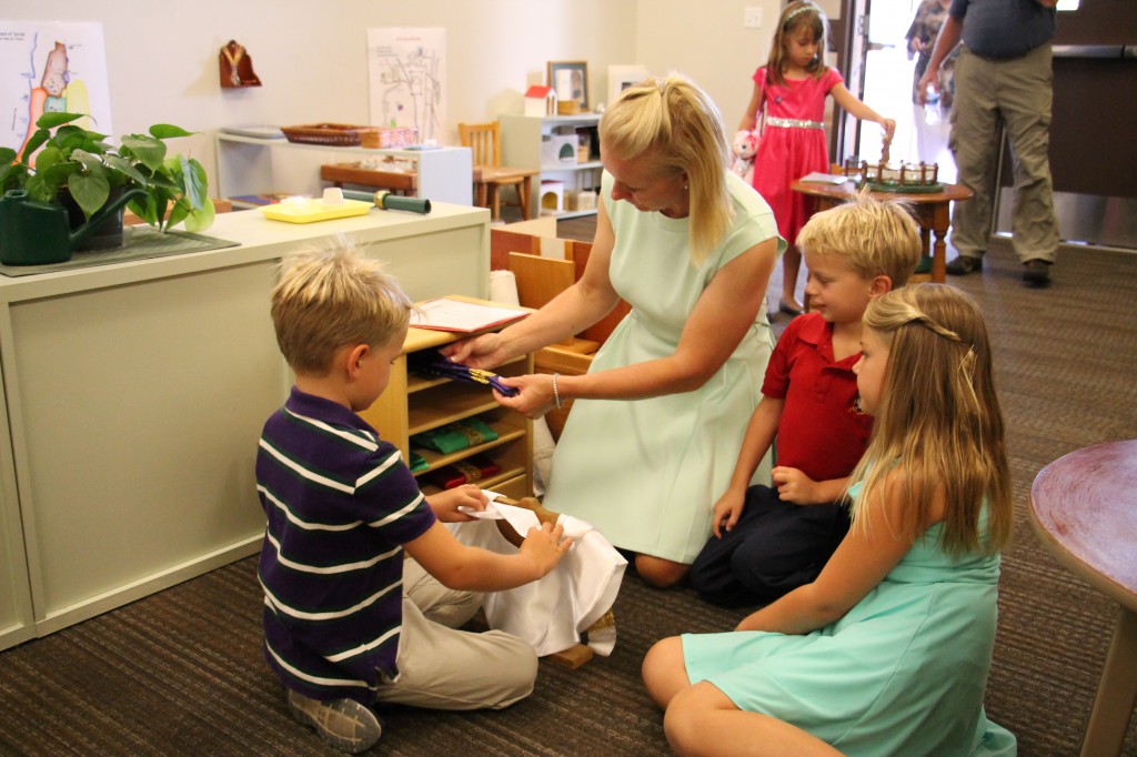 Catechists encourage children to draw closer to Christ the Good Shepherd through hands-on activities in the atrium. 