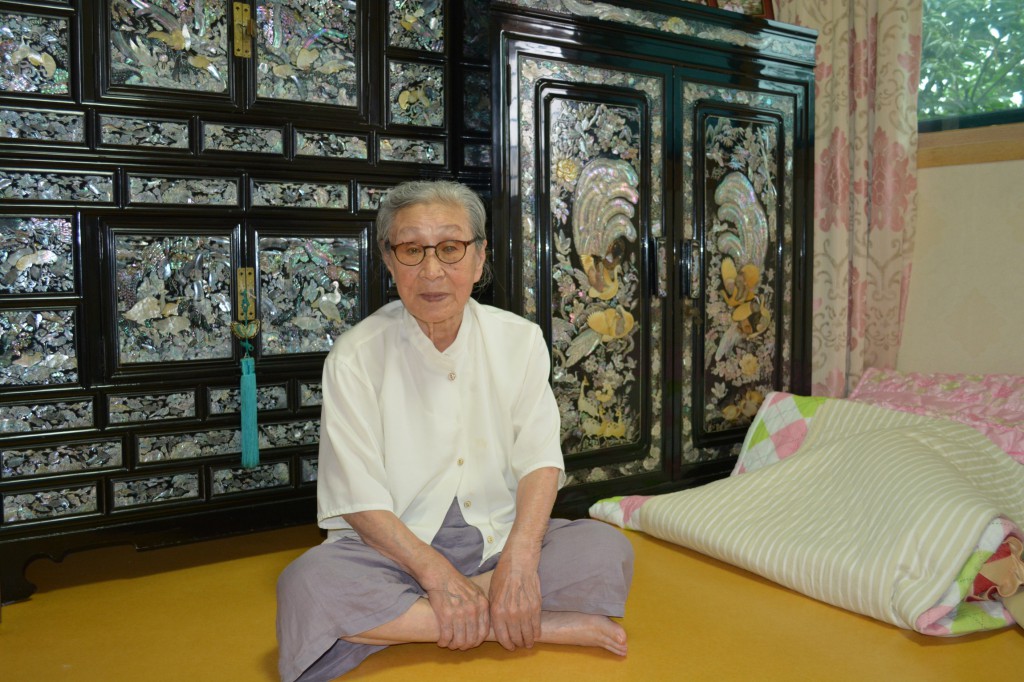 Kim Bok-dong, 88, poses for a photo in her room at a woman's shelter for "comfort women" in Seoul, South Korea, Aug. 19. She was among seven "comfort women" who had a private audience with Pope Francis before his final Mass during in South Korea the previous day. (CNS photo/Simone Orendain)
