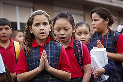 Students pray together as they start off a new school year at St. Jerome Catholic School in Phoenix Aug. 19.  (CNS photo/Nancy Wiechec)