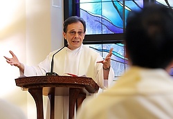 Maryknoll Father Larry Lewis delivers his homily in Chinese during a  Mass for Chinese priests and nuns at the Cenacle Retreat Center in Ronkonkoma, N.Y., Aug. 20. The retreat was affiliated with Maryknoll's Chinese Seminary Teachers and Formators Project. (CNS photo/Gregory A. Shemitz)