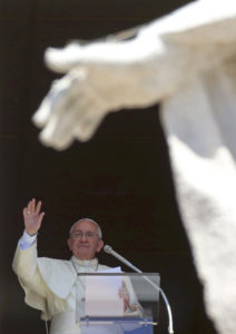 Pope Francis waves as he leads his Angelus from the window of his office in St. Peter's Square at the Vatican Sept. 7.  (CNS photo/Alessandro Bianchi, Reuters)  
