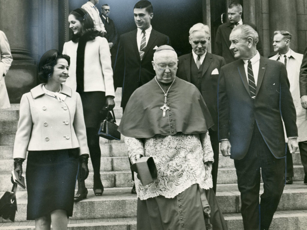 Then-Archbishop Patrick A. O'Boyle of Washington walks with U.S. President Lyndon B. Johnson following a 1968 Mass in Washington. The archbishop, who was later named a cardinal, was a vocal supporter of the Civil Rights Act, signed into law by Johnson July 2, 1964. He also integrated Catholic schools in the Washington Archdiocese 16 years before the Civil Rights Act. (CNS file photo)