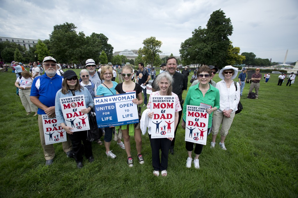 Fr. Rick Kosisko of Greensburg, Pa., poses for a photo along with other parishioners from the Diocese of Greensburg June 19 during the second annual March for Marriage on the West Lawn of the Capitol in Washington. "I really believe in marriage and in family," Fr. Kosisko said. "Maybe we need to do a better job celebrating traditional marriage and the family." (CNS photo/Tyler Orsburn) 