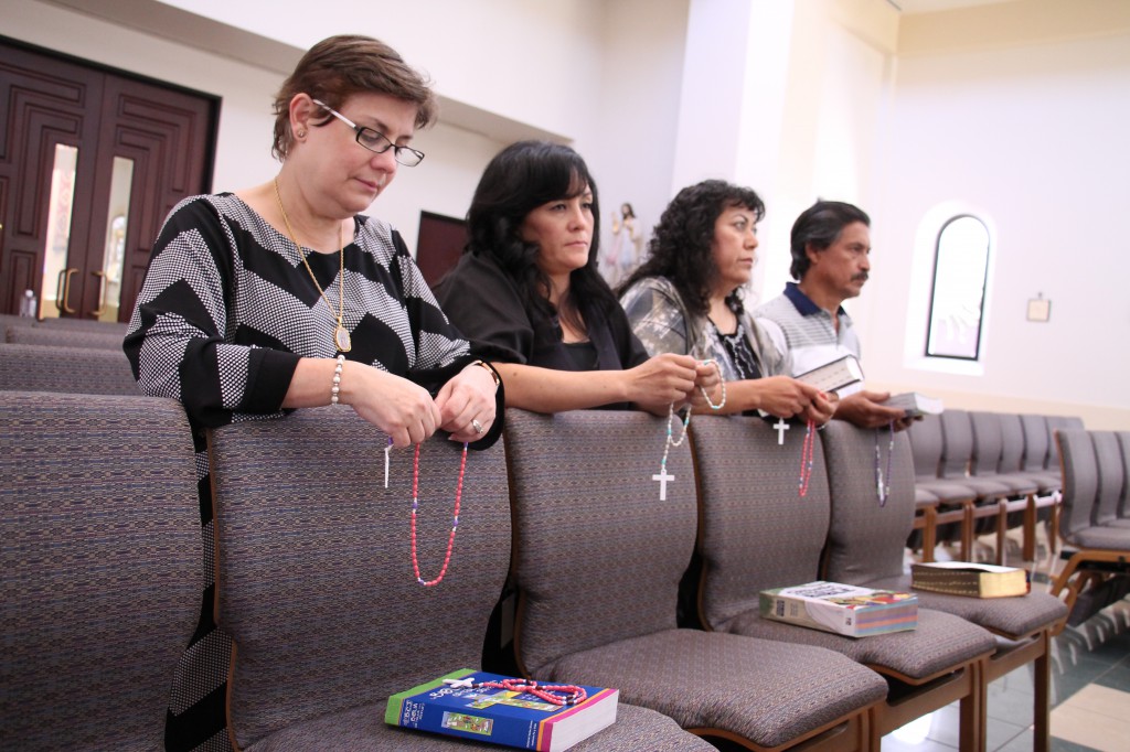 Carmen Portela, Yanet Cortes and St. Augustine parishioners Maria and Julian Muñoz regularly share rosaries and the Gospel message with the immigrant children being held in Arizona detention facilities. (Ambria Hammel/CATHOLIC SUN)