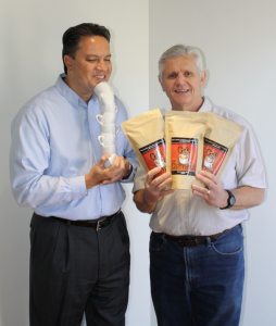 Steve Capobres of Catholic Charities and The Refuge and Rodo Sofranac of Café Esperanza are ensuring the café and wine bar has plenty to share on National Coffee Day Sept. 29. (courtesy photo) 