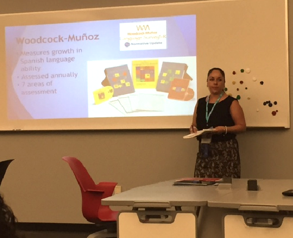 Brenda Portillo, who teaches kindergarteners in Spanish at St. Matthew, explains the assessment method the school uses to track academic progress in dual language learning Sept. 26. (courtesy photo)