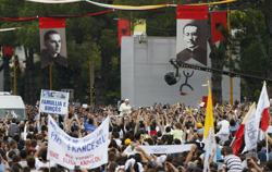 Banners depict Albanian martyrs, most of whom died under communism, as Pope Francis arrives to celebrate Mass in Mother Teresa Square in Tirana, Albania, Sept. 21. (CNS photo/Paul Haring) 