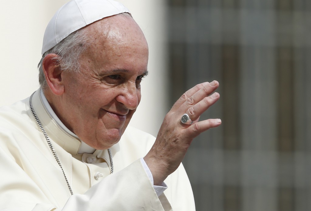 Pope Francis waves as he leaves his general audience in St. Peter's Square at the Vatican Sept. 17. (CNS photo/Paul Haring) 