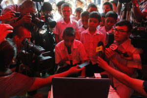 Salvadoran Gerardo Ernesto Mancia, 15, video chats with Pope Francis in San Salvador's gang-infested neighborhood of La Campanera Sept. 4. The pope said all of society needs to help children and young people who are homeless, exploited, victims of violence or without any prospects. (CNS photo/ Jose Cabezas, Reuters) 