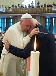 Pope Francis embraces Franciscan Father Ernest Simoni during a visit to Tirana, Albania, Sept. 21. Pope Francis wept when he heard the testimony of Father Simoni, 84, who for 28 years was imprisoned, tortured and sentenced to forced labor for refusing to speak out against the Catholic Church as his captors wanted. (CNS photo/L'Osservatore Romano via EPA)