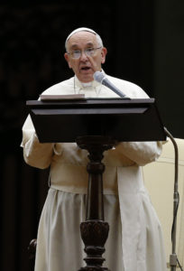 Pope Francis speaks as he leads an Oct. 4 prayer vigil for the extraordinary Synod of Bishops on the family in St. Peter's Square at the Vatican. The pope called for "sincere, open and fraternal" debate during the two-week long synod, which opens Oct. 5. (CNS photo/Paul Haring)