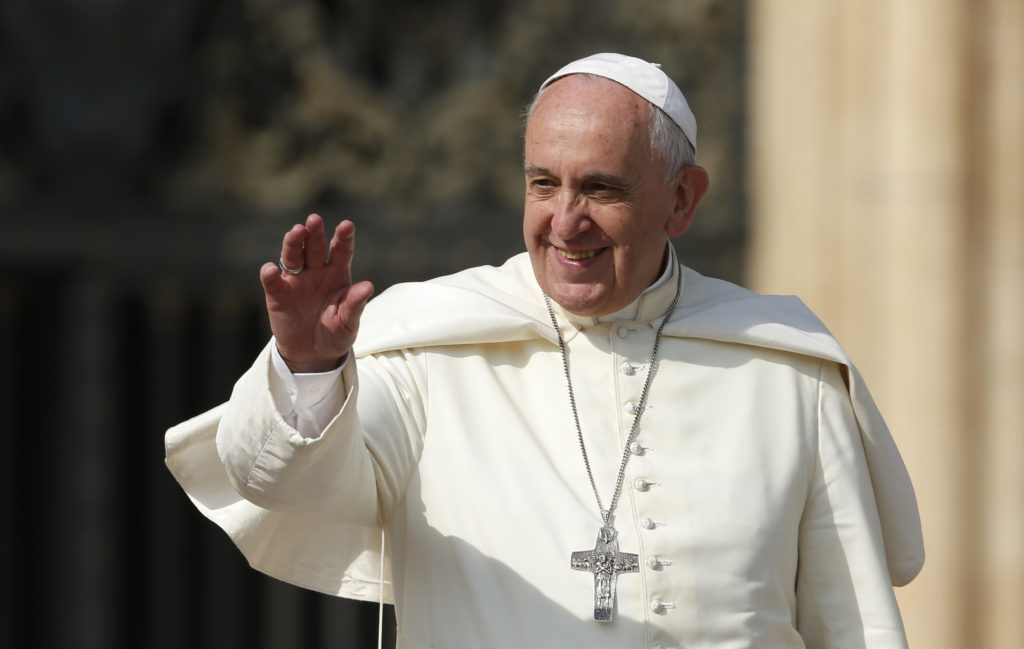 Pope Francis greets the crowd during his general audience in St. Peter's Square at the Vatican Oct. 8. (CNS photo/Paul Haring)