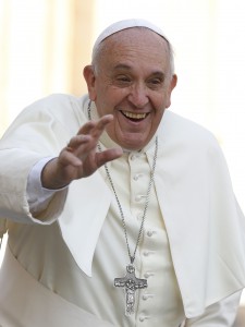 Pope Francis waves as he arrives to lead his general audience in St. Peter's Square at the Vatican Oct. 8. (CNS photo/Paul Haring)