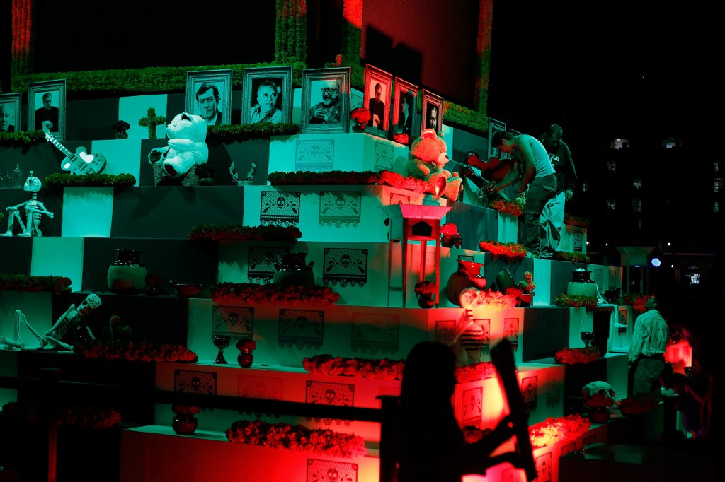 Workers assemble an altar, which is part of an art installation to celebrate the Day of the Dead in Zocalo Square, Mexico City, Oct. 30. (CNS photo/Tomas Bravo, Reuters)