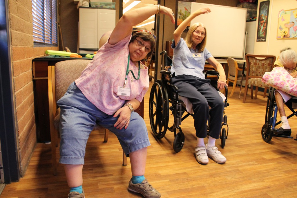 Clients at the Foundation for Senior Living’s Tempe Adult Day Health Center get a lesson in strengthening and fall prevention July 3. Millions of elderly adults fall each year, often leading to fractures and other trauma. FSL has three adult day health centers in the Valley where seniors and the disabled receive care. (Ambria Hammel/CATHOLIC SUN)