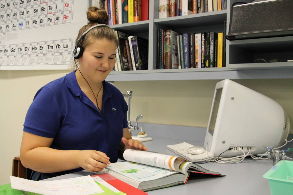 Kate Witt, a sophomore at Xavier College Preparatory, demonstrates use of audio notes to aid with a learning disability. (Ambria Hammel/CATHOLIC SUN)