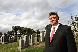 George Borrero, managing director of the trustees of St. Patrick's Cathedral, the group responsible for four large cemeteries in the Archdiocese of New York, poses at Calvary Cemetery in the Woodside section of the Queens borough of New York Oct. 21. (CNS photo/Gregory A. Shemitz) 