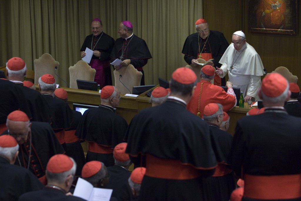 Pope Francis talks with a cardinal prior to the start of the consistory for the canonizations of Giuseppe Vaz and Maria Cristina dell'Immacolata Concezione in the Synod Hall at the Vatican Oct. 20. At the consistory, Pope Francis also discussed the Middle East. (CNS photo/Maria Grazia Picciarella, pool) 