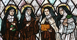 St. Teresa of Avila, second from left, is depicted among three other saints who share a first name at St. Therese of Lisieux Church in Montauk, N.Y. in this file photo. (CNS photo/Gregory A. Shemitz, Long Island Catholic)